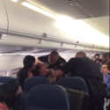 a police officer kissing a woman in an airplane