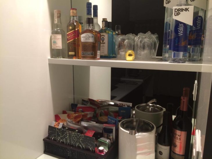 a shelf with bottles and other objects on it