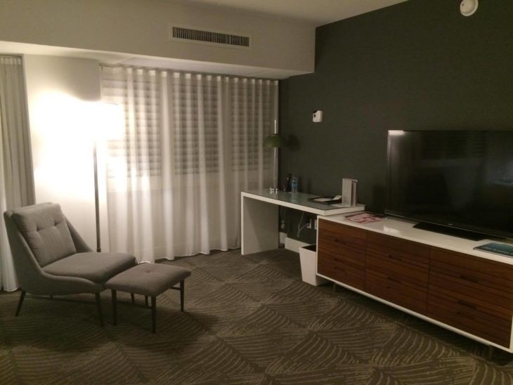 a room with a tv and a chair