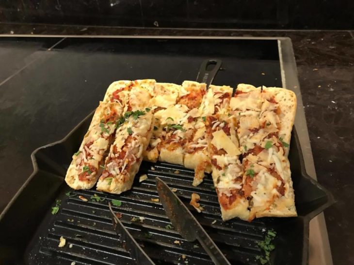 a pizza on a grill