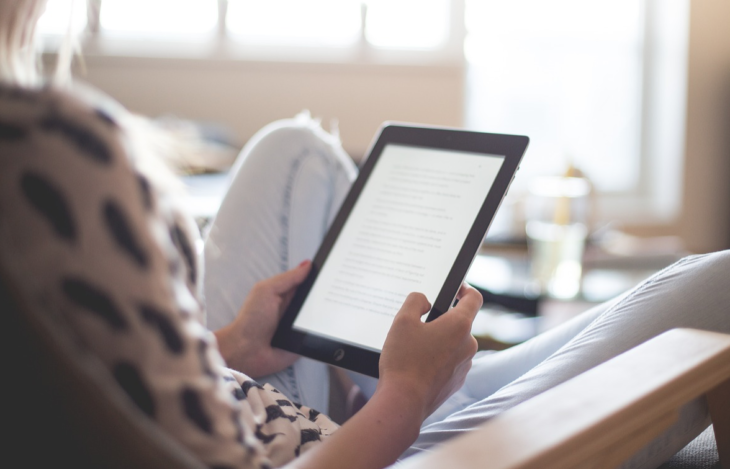 a person holding a tablet