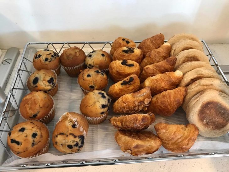 a tray of pastries and muffins