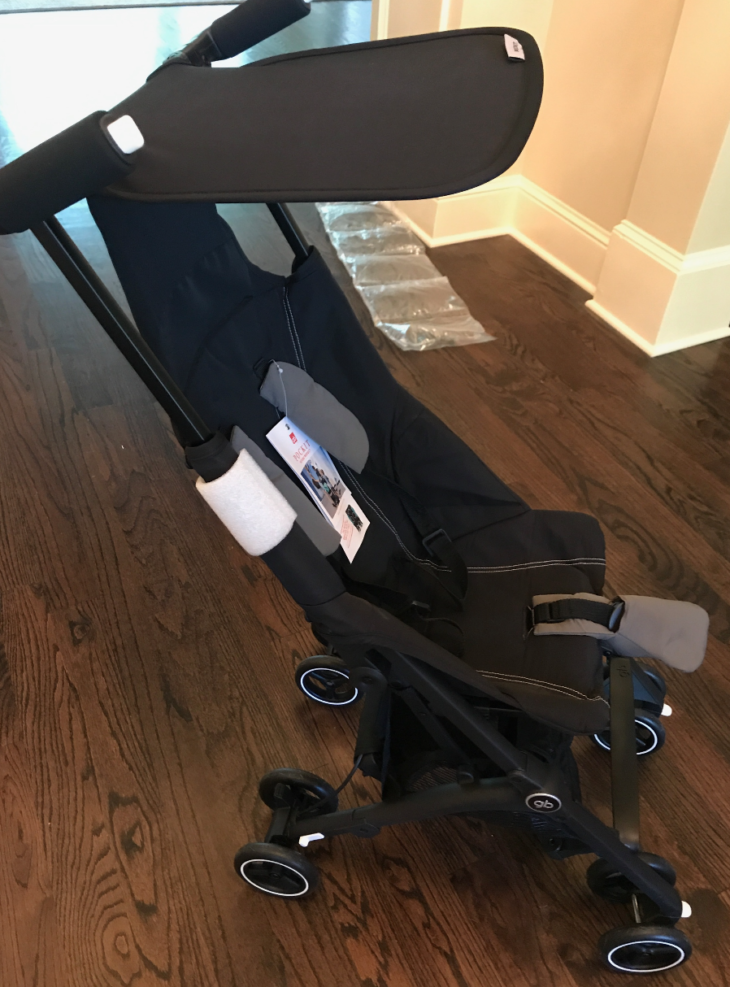 a black stroller with white trim