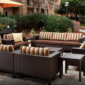 a patio area with furniture and umbrellas