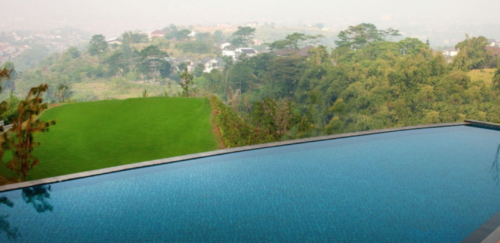 a pool overlooking a landscape