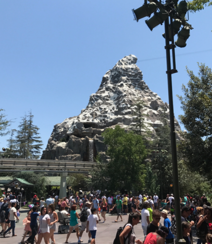 a group of people in front of Matterhorn Bobsleds