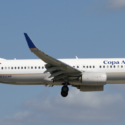 a white airplane flying in the sky