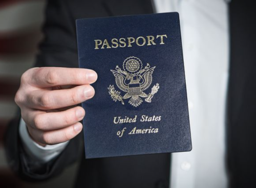 a person holding a passport