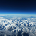 a aerial view of snowy mountains