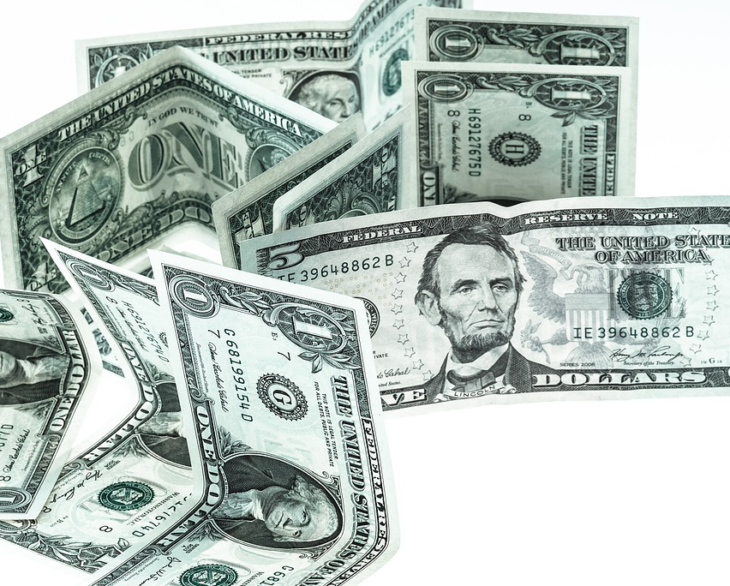 a close-up of several dollar bills