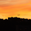 an airplane flying over a city