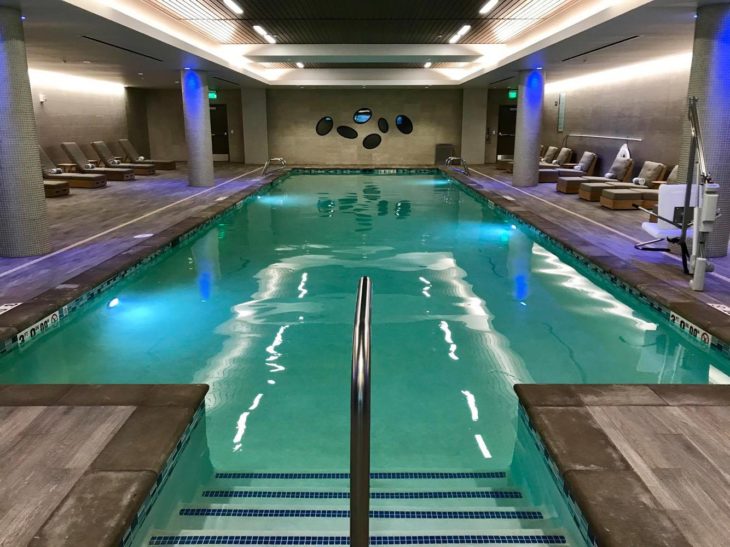 a indoor pool with a railing