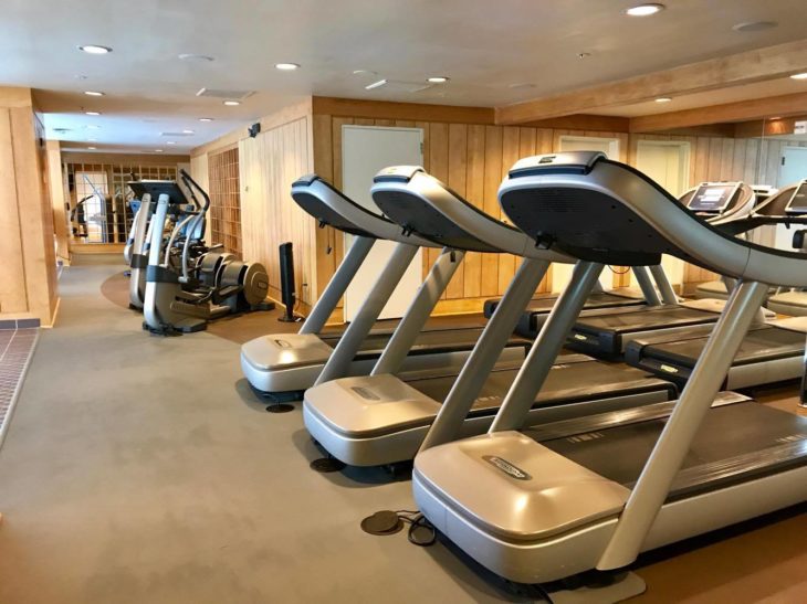 a group of treadmills in a gym