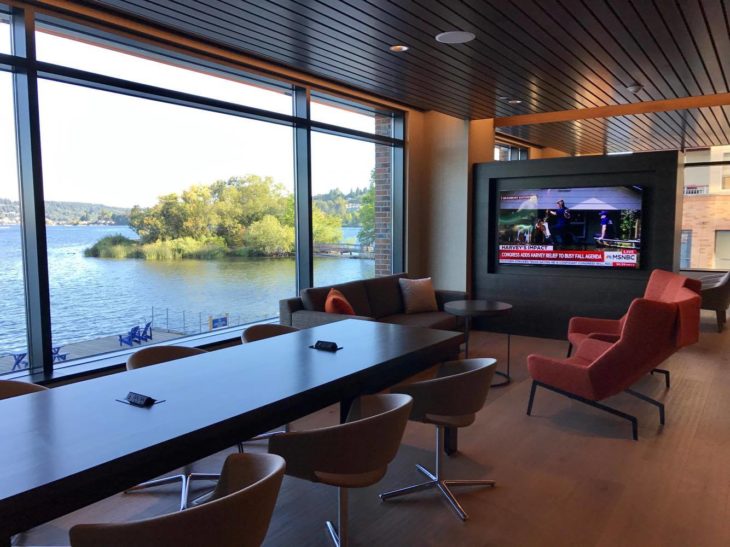 a room with a large television and a lake