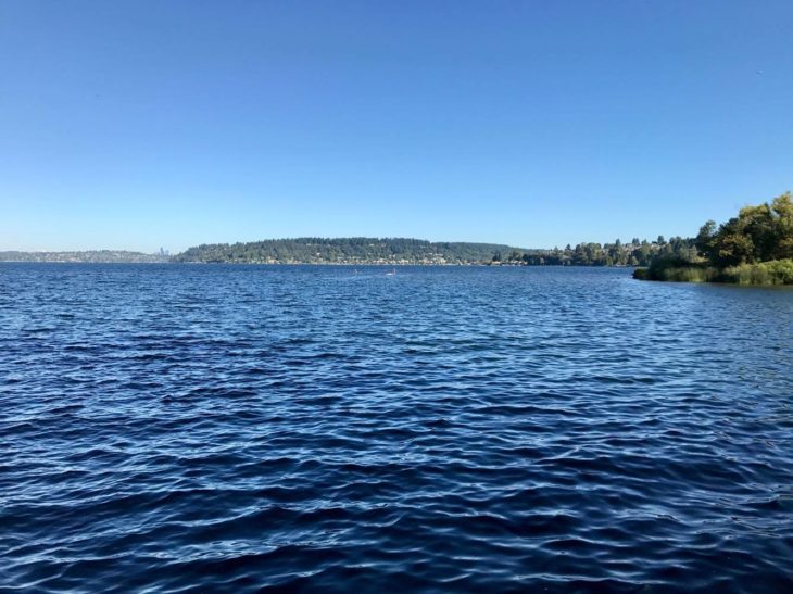 a body of water with a land in the background