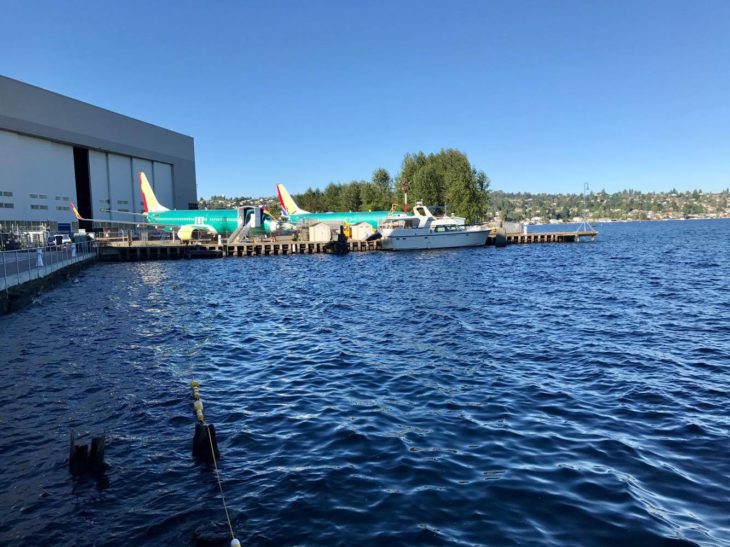 a body of water with airplanes and boats