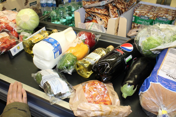 a grocery store shelf with various groceries