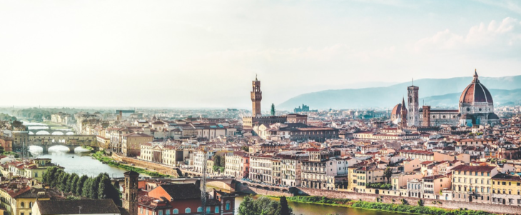 a city with a river and a tower