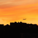 an airplane flying over a city