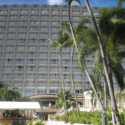 a large hotel with palm trees