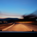 a blurry image of a road at night