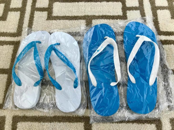 a group of flip flops in plastic wrap