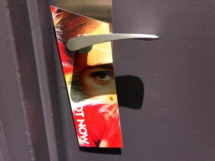 a poster on a door handle