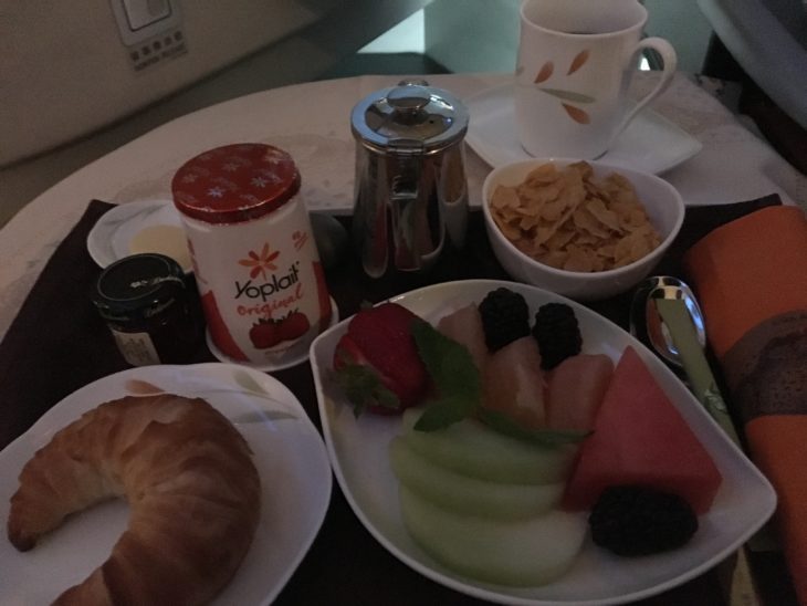 a plate of fruit and cereal on a table