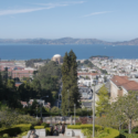 a view of a city from a hill