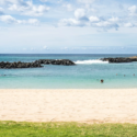 a beach with rocks and water