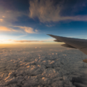 an airplane wing above clouds