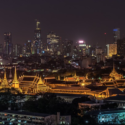 a city skyline with many buildings and a city in the background