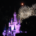 a castle with fireworks in the background