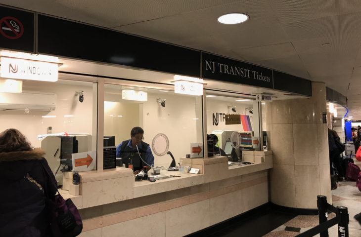 a man at a ticket counter