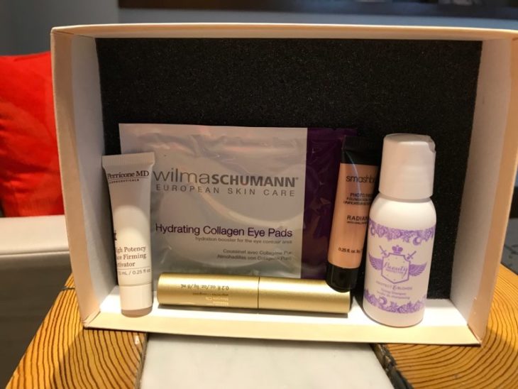 a box with a variety of cosmetics