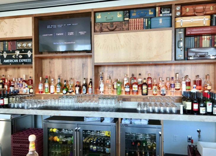 a bar with bottles and glasses