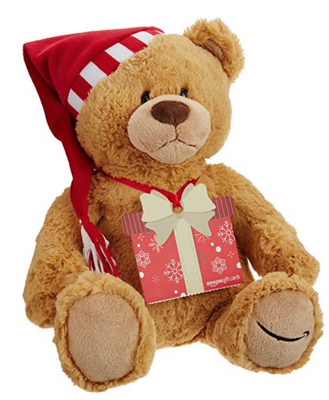 a stuffed bear wearing a hat and a red and white striped hat