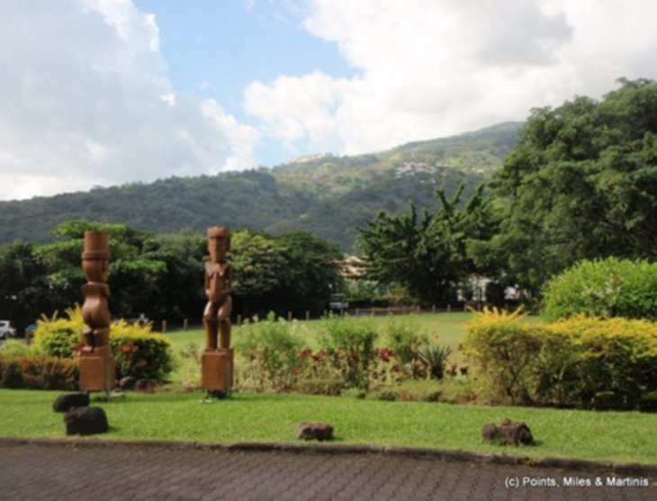 a group of statues in a park