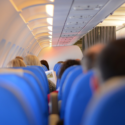a group of people sitting in an airplane