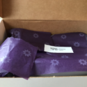 a box with purple wrapping paper