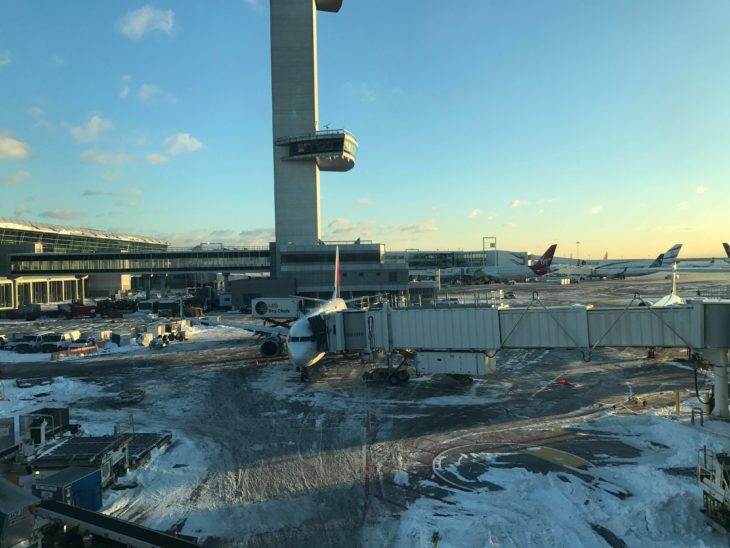 an airport with an airplane in the snow