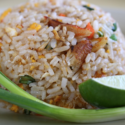 a plate of rice and a lime