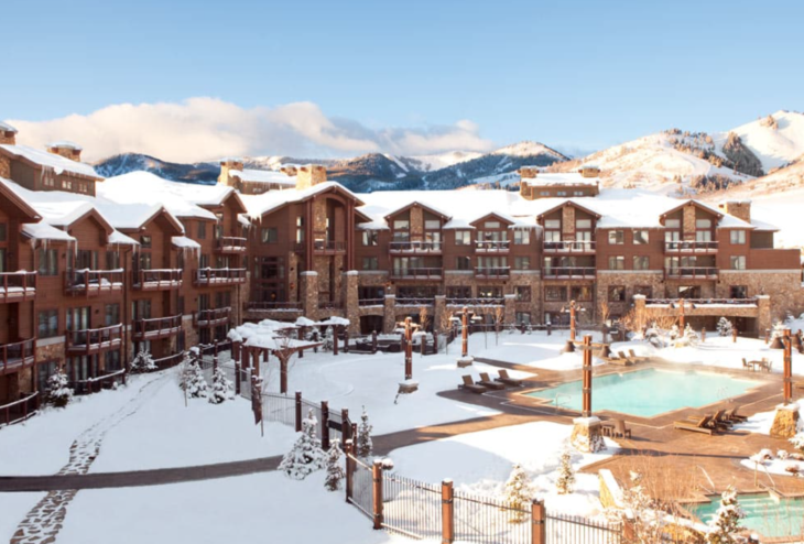 a building with a pool in the snow