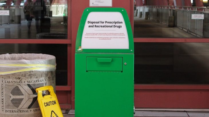 a green container with a sign on it