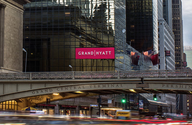 a bridge over a street with a sign on it