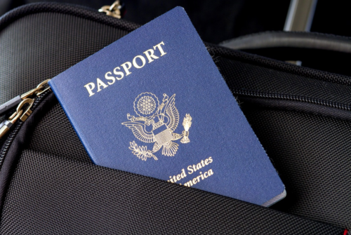 a passport in a black bag