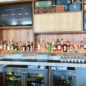 a bar with bottles and glasses