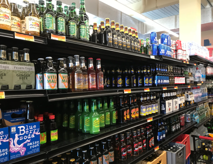 shelves of a store with bottles of beer