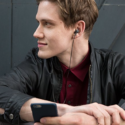 a man with earphones and a phone