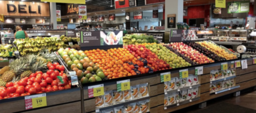 a grocery store with lots of fruits